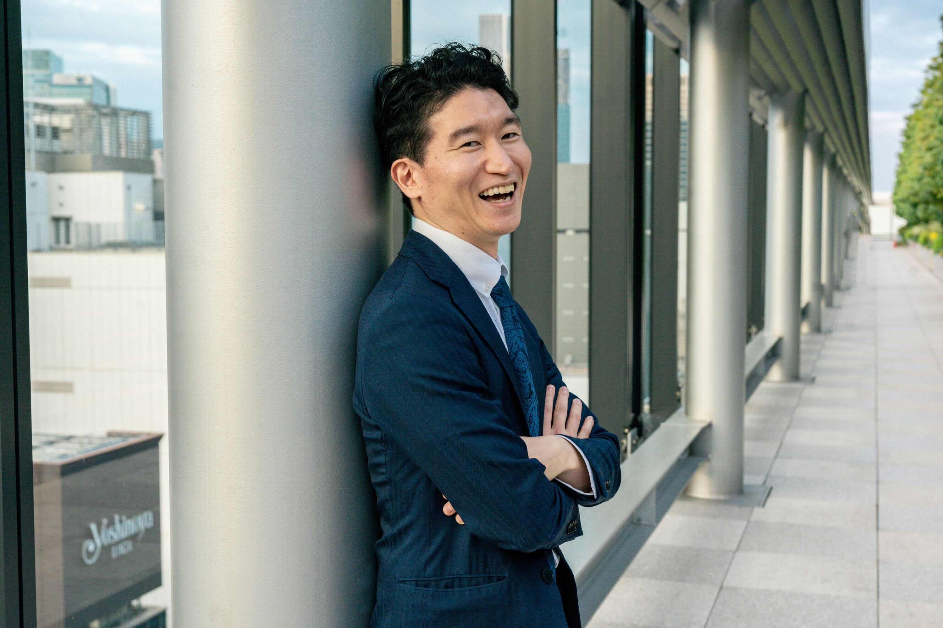 A image of a concrete sphere, balanced between two other larger spheres